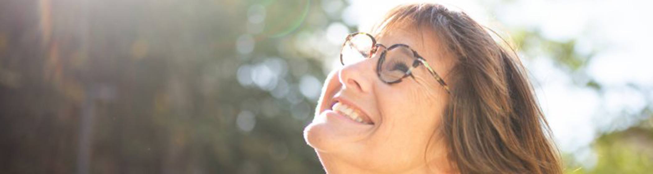 Lady smiles at the sun