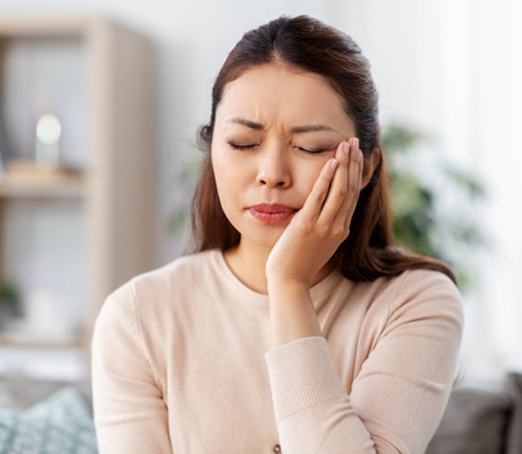 Patient experiencing toothache at home
